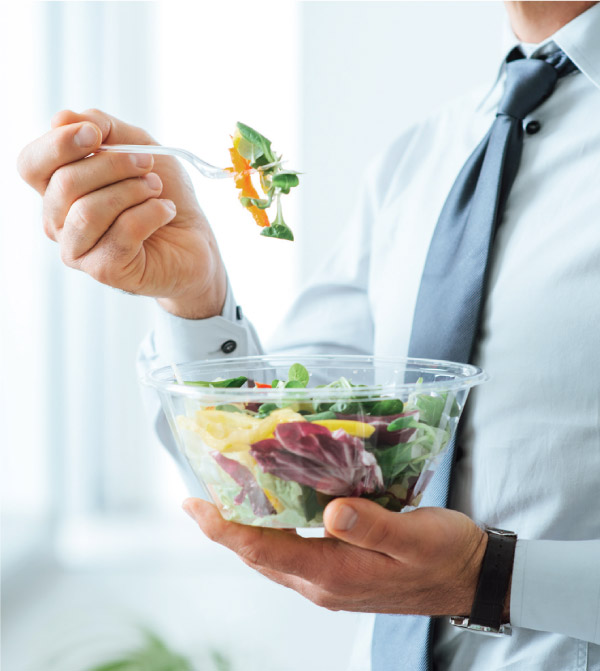 man eating a salad